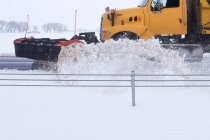 Snowplough plowing road, Wyoming, America, USA — Stock Photo