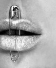 Close-up of Safety pin attached on lips — Stock Photo