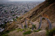 Scenic view of switchback road and Jaipur city seen from Tiger Fort, Rajasthan, India — Stock Photo