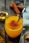 Turmeric, honey and cinnamon hot drink — Stock Photo