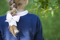 Close-up of blond girl with a braid — Stock Photo