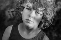 Portrait of young boy with curly hair — Stock Photo
