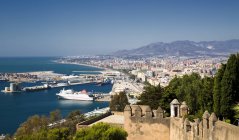 Spain, Andalusia, Malaga, Elevated view of city coastline and harbor — Stock Photo