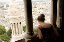 Back view of Woman looking out over city view — Stock Photo