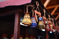 Closeup view of colorful pottery bells for sale — Stock Photo