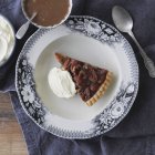 Top view of tasty Pecan pie on china plate on table — Stock Photo