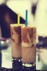 Two coffee cocktails on table, blurred background — Stock Photo