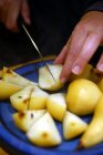 Close-up view of Hands cutting with knife fresh ripe pears in halves — Stock Photo