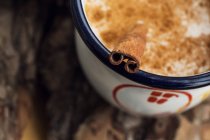 Elevated closeup view of milk with cinnamon — Stock Photo