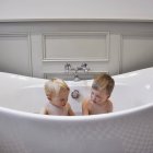 Two cute little brothers in bathroom together — Stock Photo