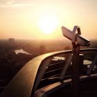 Binoculars with view of Rotterdam at sunset, The Netherlands — Stock Photo