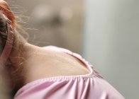 Close-up of girls neck wearing pink top — Stock Photo