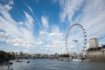 United Kingdom, England, London, London Eye seen from across River Thames — Stock Photo