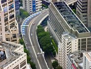 Aerial view of skyscrapers besides of highway — Stock Photo