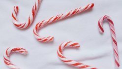 Closeup view of Candy canes over white background — Stock Photo