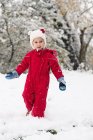 Girl playing in the snow — Stock Photo