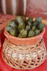 Stuffed vine leaves in bowl, closeup view — Stock Photo