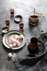 Composition of turkish delight and coffee over table — Stock Photo