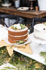 Triple layer victoria sponge cake decorated with flowers — Stock Photo