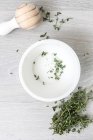 Top view of pestle and mortar with thyme — Stock Photo