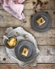 Top view of Two plates with apple cake and custard — Stock Photo
