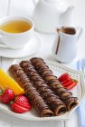Chocolate crepes with tea — Stock Photo