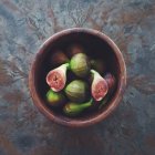 Top view of bowl with figs over marble table — Stock Photo