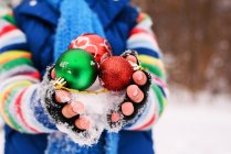 Close-up view of Boy holding Christmas decorations — Stock Photo