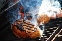 Steaks grilling on a barbecue, closeup view — Stock Photo