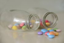Two bottles with smarties, closeup view — Stock Photo