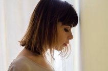 Portrait of beautiful young woman in profile — Stock Photo