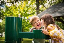 Two children drinking from a water fountain — Stock Photo