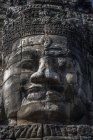 Cara de piedra tallada, Templo de Bayon, Angkor Wat, Camboya - foto de stock
