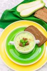 Tasty zucchini soup with rye bread, elevated view — Stock Photo
