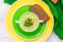 Zucchini soup with rye bread, elevated view — Stock Photo