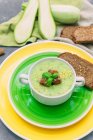 Fresh and tasty zucchini soup with rye bread — Stock Photo