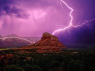 Lightning storm around Bell Rock and Courthouse Butte, Sedona, Arizona, America, USA — Stock Photo