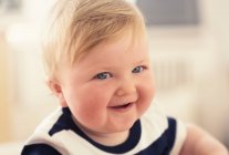 Portrait of adorable little smiling boy at home — Stock Photo