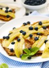 Crepes with bananas, blueberries and yogurt — Stock Photo