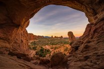 View through Double Arch, Parade of Elephants Trail, Arches National Park, Utah, America, USA — Stock Photo