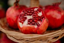 Closeup view of fresh Pomegranates in a basket — Stock Photo