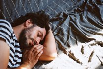 Portrait of a man sleeping on the coach in the afternoon — Stock Photo