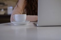 Woman working on her laptop — Stock Photo