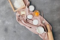 Ingredients for baking. homemade bread, eggs, flour, butter, milk, whisk, top view — Stock Photo