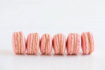 Delicious sweet macaroons on white background - foto de stock