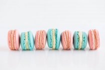 Delicious sweet macaroons on white background — Stock Photo