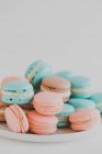 Delicious sweet macaroons on white background — Stock Photo
