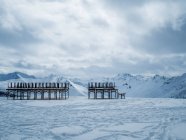Chairs and tables stacked in the snow, Ischgl, Landeck, Tyrol, Austria — Stock Photo