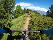 Two people mountain biking in Dolomites, Val D'Aosta, Italy — Stock Photo