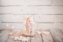 Mason jar filled with miniature, marshmallows — Stock Photo